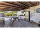 This outdoor kitchen features stainless steel appliances and a wooden picnic table at 2824 Oak Lea Dr, South Daytona, FL 32119