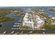 Stunning aerial view of waterfront condos and boat docks on the Florida coast at 3 Riverwalk Dr # 202, New Smyrna Beach, FL 32169