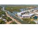 Breathtaking aerial view of waterfront condos and a boat canal at 3 Riverwalk Dr # 202, New Smyrna Beach, FL 32169
