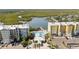 Aerial view of the waterfront condominium complex with pool and docks at 3 Riverwalk Dr # 202, New Smyrna Beach, FL 32169