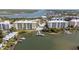 Scenic aerial view showcasing waterfront condos and boat docks at 3 Riverwalk Dr # 202, New Smyrna Beach, FL 32169