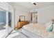 Comfortable bedroom with balcony access, and an en suite bathroom providing a private retreat at 3 Riverwalk Dr # 202, New Smyrna Beach, FL 32169