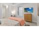 Cozy bedroom includes a flat-screen television and a dedicated workspace, perfect for work or study at 3 Riverwalk Dr # 202, New Smyrna Beach, FL 32169