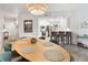 Elegant dining area with a view of the modern kitchen and living room at 3 Riverwalk Dr # 202, New Smyrna Beach, FL 32169