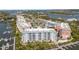 An exterior view of beautiful condos with a tranquil waterfront and marina at 3 Riverwalk Dr # 202, New Smyrna Beach, FL 32169