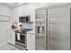 Well-equipped kitchen with stainless steel appliances and ample cabinet space at 3 Riverwalk Dr # 202, New Smyrna Beach, FL 32169