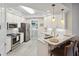 Updated kitchen featuring white cabinets, subway tile backsplash, and stainless steel appliances at 3 Riverwalk Dr # 202, New Smyrna Beach, FL 32169