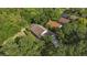 A beautiful aerial view of a home nestled among lush greenery and mature trees in a serene neighborhood at 30 Reflections Village Dr, Ormond Beach, FL 32174