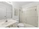 Bright bathroom features a single sink vanity and shower with sliding glass door at 30 Reflections Village Dr, Ormond Beach, FL 32174