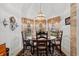 Sunlit breakfast nook features a round table set for four with three windows providing natural light at 30 Reflections Village Dr, Ormond Beach, FL 32174