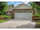 Charming home with a well-manicured front yard and an attached two-car garage, providing curb appeal at 30 Reflections Village Dr, Ormond Beach, FL 32174