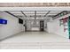 A clean, spacious two-car garage features ample storage, including a sink, white cabinets, and work bench at 30 Reflections Village Dr, Ormond Beach, FL 32174