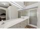 Bright main bathroom with double sinks, vanity and large walk-in shower with glass enclosure at 30 Reflections Village Dr, Ormond Beach, FL 32174