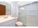 Bathroom featuring a glass-enclosed shower, white vanity, and modern fixtures at 3107 Mapleshade St, Deltona, FL 32738