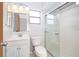 Clean and contemporary bathroom with glass shower enclosure and vanity at 3107 Mapleshade St, Deltona, FL 32738