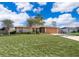 Charming single-story home boasts a large front yard, long driveway, and attached two-car garage at 3107 Mapleshade St, Deltona, FL 32738