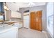 Functional kitchen featuring white appliances and convenient storage solutions at 3107 Mapleshade St, Deltona, FL 32738