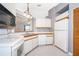 Efficient kitchen with white appliances and ample counter space for meal preparation at 3107 Mapleshade St, Deltona, FL 32738