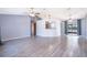Open-concept living room with luxury vinyl flooring and abundant natural light at 3107 Mapleshade St, Deltona, FL 32738