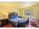 This cozy bedroom features hardwood floors, a large window, and comfortable furnishings at 313 Dirksen Dr # A5, Debary, FL 32713