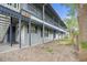 Exterior view of two-story building with balconies and well-maintained grounds at 313 Dirksen Dr # A5, Debary, FL 32713