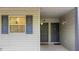 Charming exterior featuring two front doors and window with blue shutters at 313 Dirksen Dr # A5, Debary, FL 32713