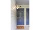 Close up of front door #5 and welcome mat for this home at 313 Dirksen Dr # A5, Debary, FL 32713