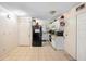 Functional kitchen with tile flooring and white cabinets. Black appliances at 313 Dirksen Dr # A5, Debary, FL 32713