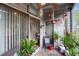 Cozy screened-in patio with comfortable seating, decorative plants, and a relaxing atmosphere at 313 Dirksen Dr # A5, Debary, FL 32713
