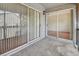 View of the outdoor balcony with sliding glass doors leading inside and carpet flooring at 313 Dirksen Dr # B15, Debary, FL 32713