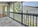 A screened balcony offering a view of the surrounding neighborhood at 313 Dirksen Dr # B15, Debary, FL 32713