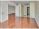 Spacious bedroom with hardwood floors and access to the bathroom area at 313 Dirksen Dr # B15, Debary, FL 32713
