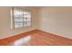 Bedroom with hardwood floors and a large window overlooking the outside at 313 Dirksen Dr # B15, Debary, FL 32713