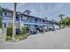 Charming exterior view of blue two-story building with balcony and parking in front at 313 Dirksen Dr # B15, Debary, FL 32713