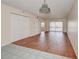 Open living space featuring tile and wood flooring, closet space, and a sliding glass door at 313 Dirksen Dr # B15, Debary, FL 32713