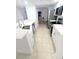 Updated kitchen features stainless steel appliances, white cabinets, and quartz countertops at 3311 S Atlantic Ave # 604, Daytona Beach Shores, FL 32118