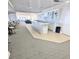 Clubhouse kitchenette and bar area with a seamless open-concept design at 3311 S Atlantic Ave # 604, Daytona Beach Shores, FL 32118