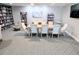 Library with extensive bookshelves, lounge seating, and tables for reading at 3311 S Atlantic Ave # 604, Daytona Beach Shores, FL 32118