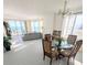Spacious living room with ocean views, bright floors, comfortable seating, and a cozy dining area at 3311 S Atlantic Ave # 604, Daytona Beach Shores, FL 32118