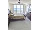 Relaxing main bedroom featuring ocean view, balcony access, and sleek TV dresser for added comfort at 3311 S Atlantic Ave # 604, Daytona Beach Shores, FL 32118