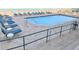 Refreshing pool surrounded by lounge chairs, offering a relaxing and social outdoor space at 3311 S Atlantic Ave # 604, Daytona Beach Shores, FL 32118