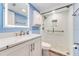 Bathroom featuring modern vanity, illuminated mirror, and shower with updated fixtures at 3606 S Peninsula Dr # 507, Port Orange, FL 32127