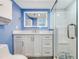 Bright bathroom with new vanity, decorative floor tiles, walk-in shower with glass door at 3606 S Peninsula Dr # 507, Port Orange, FL 32127