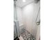 Walk-in shower with glass door and wavy tile and bench at 3606 S Peninsula Dr # 507, Port Orange, FL 32127