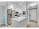 Bright modern kitchen with stainless steel appliances, a center island, and ample storage at 3606 S Peninsula Dr # 507, Port Orange, FL 32127