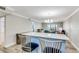 Open-concept living space with a breakfast bar, stylish chairs, and a chandelier at 3606 S Peninsula Dr # 507, Port Orange, FL 32127