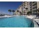 Outdoor pool with a view of the Halifax River and the condo building at 3606 S Peninsula Dr # 507, Port Orange, FL 32127