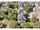 Stunning aerial view of a home with a private pool, lush greenery, and a well-maintained neighborhood at 3698 Lower Park Rd, Orlando, FL 32814