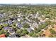 Neighborhood aerial view, showcasing the home's convenient location surrounded by lush trees at 3698 Lower Park Rd, Orlando, FL 32814