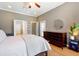 Bedroom features hardwood floors, large windows and a dresser, creating a relaxing atmosphere at 3698 Lower Park Rd, Orlando, FL 32814